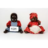 Two mid 20th century miniature articulated black dolls; both clothed H. 12 cms