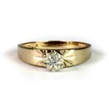 A 9ct yellow gold ring set with a solitaire diamond (L).