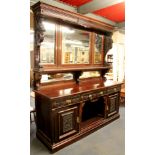 A large 19th century carved mahogany mirror backed buffet sideboard, W. 216cm, H. 240cm.