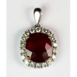 A lovely 18ct white gold (stamped 750) pendant set with a large ruby (approx. 8ct) surrounded by 0.