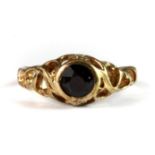 A 9ct yellow gold garnet set ring (K).