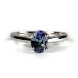 A pretty 9ct white gold ring set with an oval cut mauve tanzanite (approximately 0.75ct) (M).