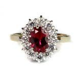 A 14ct yellow gold ruby and cubic zirconia cluster ring (M.5).