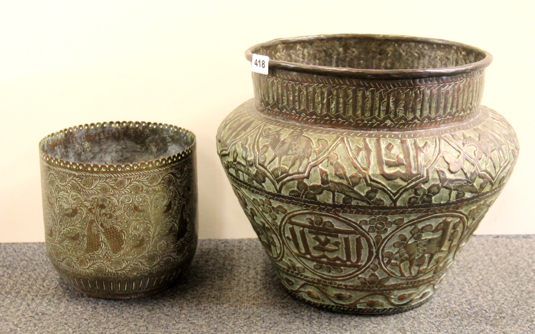 Islamic Interest, a large 19th century hammered copper planter (H. 32cm), together with a hammered