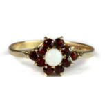 A 9ct yellow gold opal and garnet cluster ring (P).