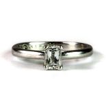 A stunning "The Leo Diamond" platinum engagement ring set with a single modified emerald cut diamond