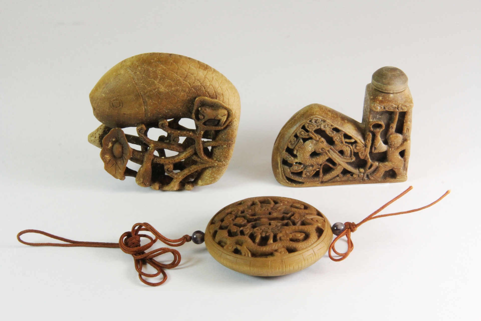 Two mid 20th century Chinese carved wooden snuff bottles and a carved wooden amulet. Prov. The - Image 2 of 2