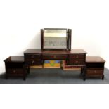 A Stag Minstrel mahogany dressing table and pair of bedside cabinets.