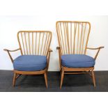 A pair of Ercol armchairs.