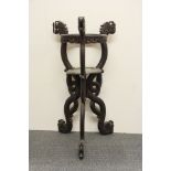 An early 20th century Chinese hardwood dragon plant holder, H. 93cm.