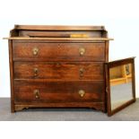 An oak three drawer dressing table.