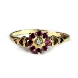 A 9ct yellow gold diamond and pink topaz cluster ring (R.5).