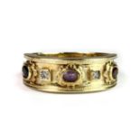 A heavy gentleman's 9ct yellow gold ring set with diamond, sapphire, amethyst and garnet (V).