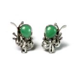 A pair of Chinese high carat white gold (with Chinese hallmarks) earrings set with polished jade.