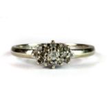 A 9ct white gold diamond set cluster ring (M).