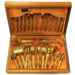 A 1970's gold plated cutlery set.