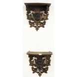 A pair of 19th century Black Forest carved wooden wall brackets mounted with Bulldog heads, W. 40cm,