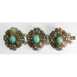 An intricate mid 20th century Chinese silver gilt bracelet decorated with coral and turquoise, W.