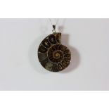 A 925 silver mounted ammonite fossil pendant.