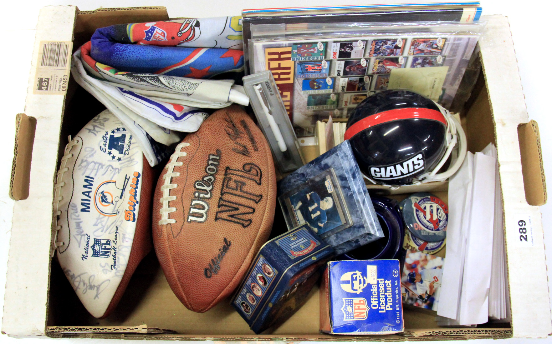 Two signed American footballs and other memorabilia.