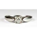 A 9ct white gold diamond set solitaire ring (N).