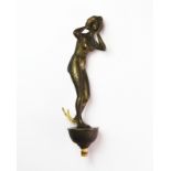 An early 20th century Austrian gilt bronze female nude bell button, H. 12cm.