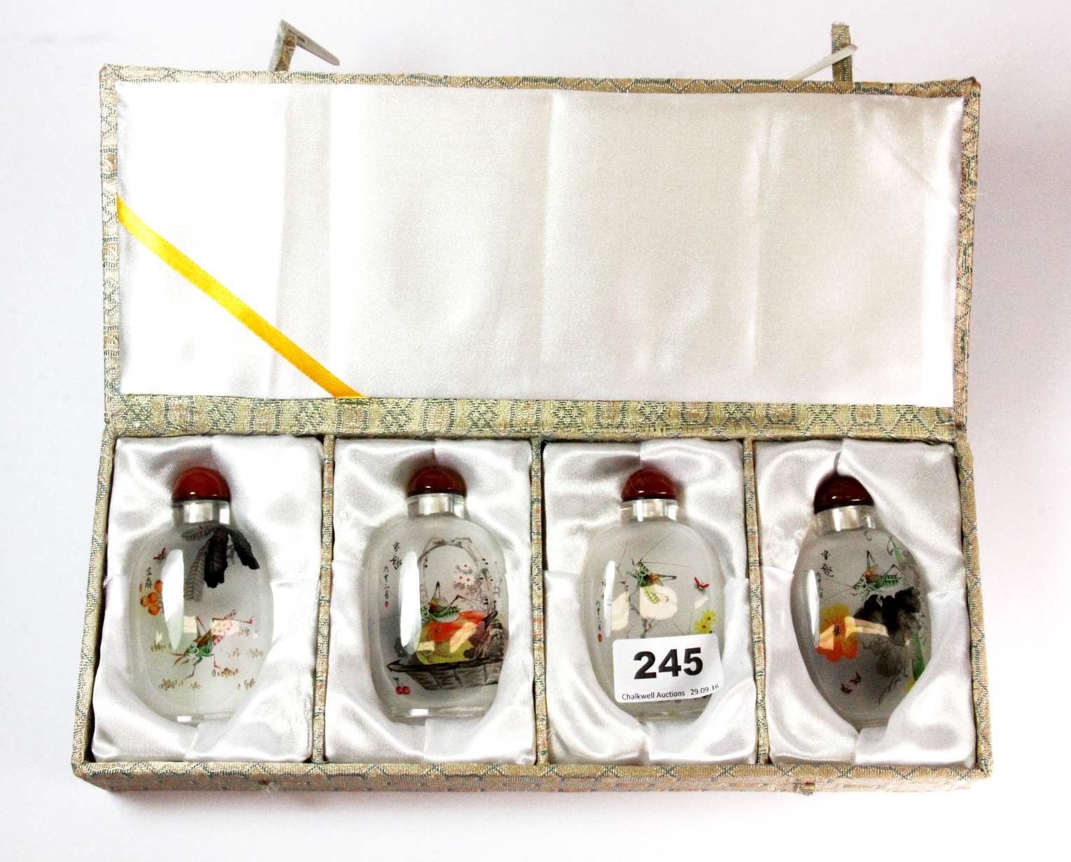 A set of four signed and beautifully decorated Chinese inside painted snuff bottles of crickets