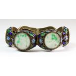 A lovely mid 20th century Chinese filigree silver gilt jade and enamel hinged bracelet, W. 2.5cm.