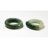 Two Chinese carved mixed green jadeite rings. Private estate purchased c. 1973.