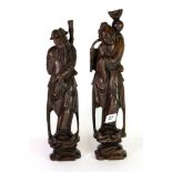 A pair of Chinese metal inlaid carved hardwood figures, H. 36cm.