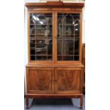 A lovely quality mahogany and fiddle backed mahogany veneered bookcase, 110 x 46 x 205cm.