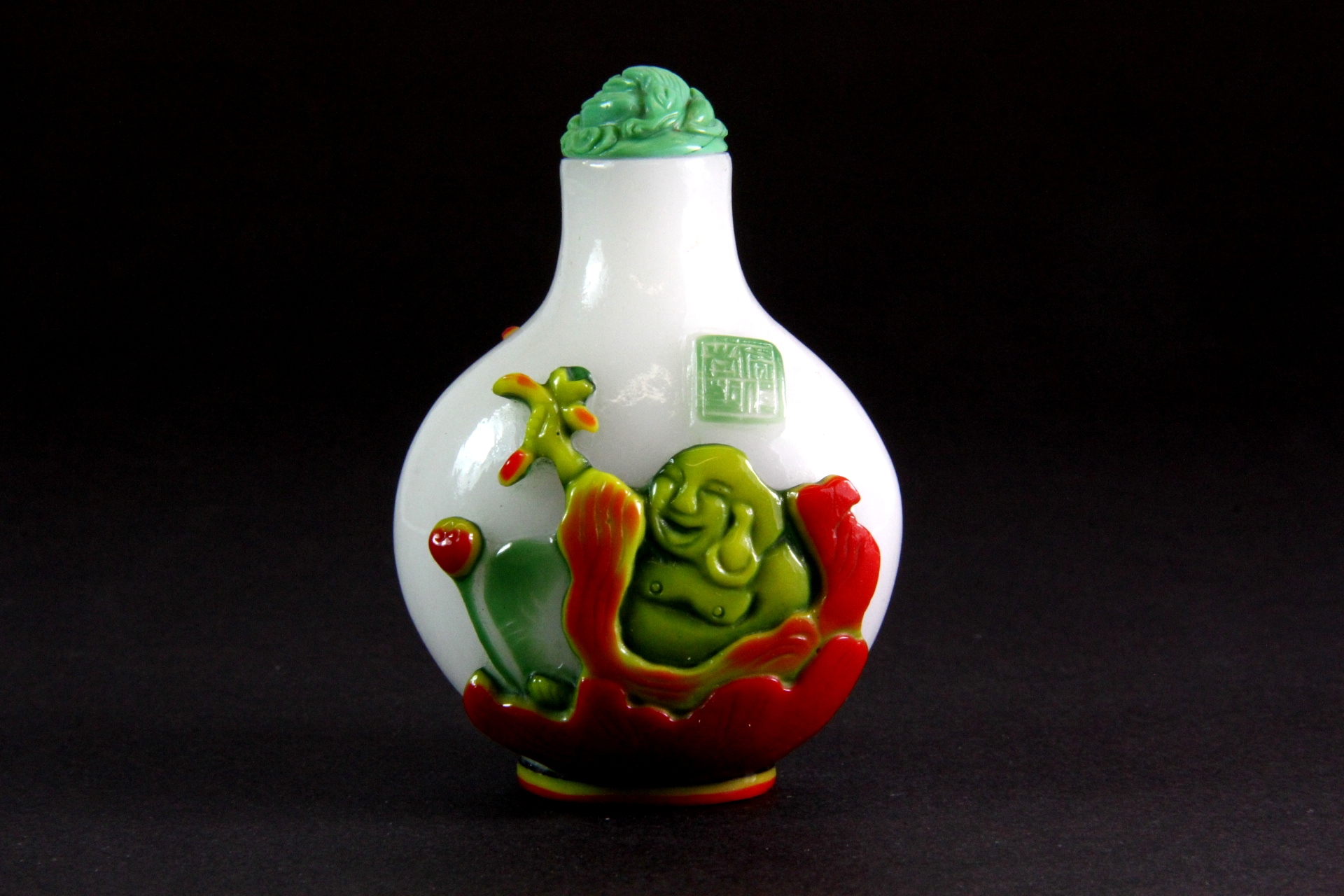 A Chinese four layer Peking glass snuff bottle of the Happy Buddha sitting in a lotus with a faux - Image 2 of 3