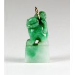 A lovely Chinese carved apple green jadeite jade lion dog pendant, H. 2.5cm.