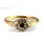 A 22ct yellow gold sapphire and stone set cluster ring (P).