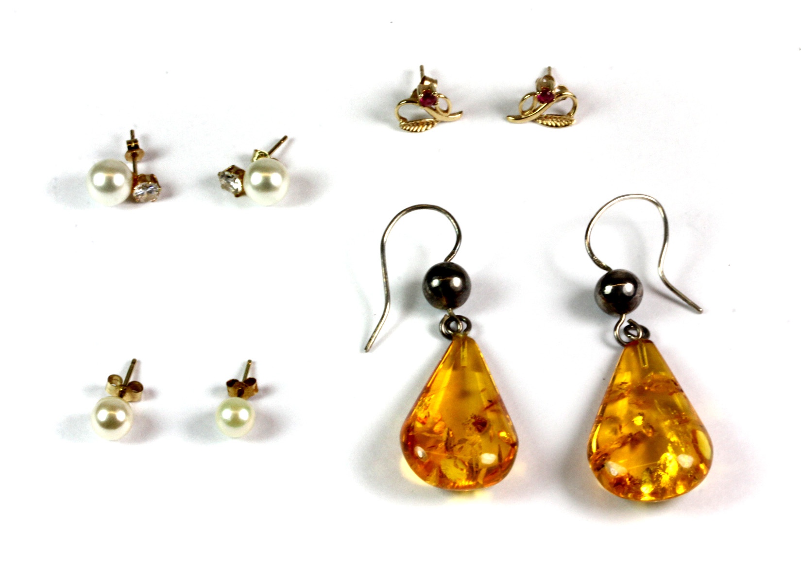 Three pairs of 9ct yellow gold earrings and a further pair of silver and amber earrings.