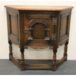 A carved oak side table / cupboard, W. 81cm, H. 71cm.