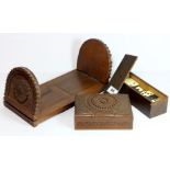 An eastern carved hardwood adjustable book rack with matching cigarette box and a set of early