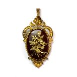A 9ct yellow gold mounted diamond set cornelian brooch/pendant, L. 5.6cm. Est. £400-600.