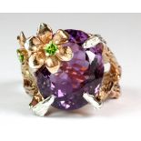 A Hana Maae designer 925 silver gilt flower shaped ring set with a beautiful oval cut amethyst and