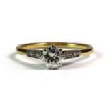 A lovely antique 18ct and platinum (worn hallmarks) brilliant cut solitaire diamond ring with