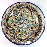 A Moroccan hand painted pottery bowl; signed to base, Dia. 34cm.