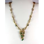 An stunning 18ct yellow gold (tested) necklace set with pear cut emeralds and brilliant cut diamonds