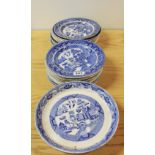 An extensive quantity of blue and white willow pattern plates.