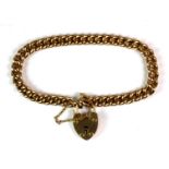 A 15ct yellow gold (stamped 15ct) link bracelet with a heart shaped clasp (approx. 13.8gr).