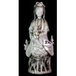 A 19th century Chinese blanc de chine figure of the Goddess Guanyin, H. 23cm.