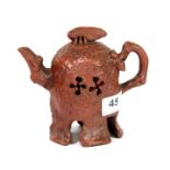 A mid 20th century Chinese Yi Xing pottery teapot with natural form decoration and cicada handle
