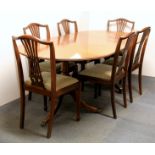 A Regency style mahogany twin pillar extending dining table raised on three out swept reeded