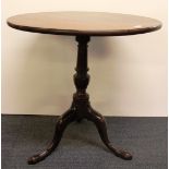 An early 19th century mahogany tilt top tea table, Dia. 72cm.