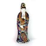 A large 19th century Japanese enamelled and gilt Kutani porcelain figure of a Buddhist Goddess, H.