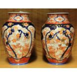 A pair of 19th century Japanese Imari vases, H. 21cm.